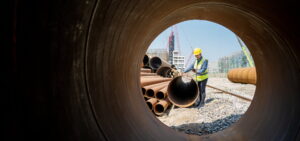 construction workers working on pipeline project